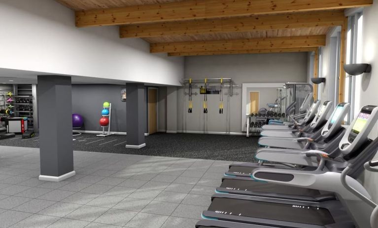 Fitness center with treadmills, machine and equipment at Hilton London Watford.