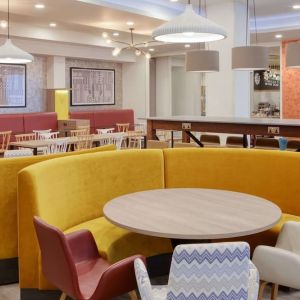 Colorful and comfortable dining area perfect for co-working at the Hampton by Hilton Manchester Northern Quarter.