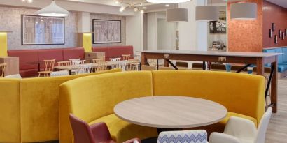 Colorful and comfortable dining area perfect for co-working at the Hampton by Hilton Manchester Northern Quarter.