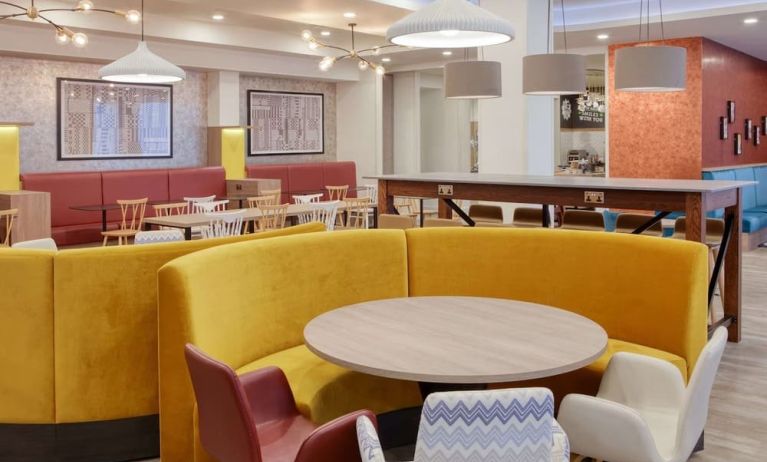 Colorful and comfortable dining area perfect for co-working at the Hampton by Hilton Manchester Northern Quarter.