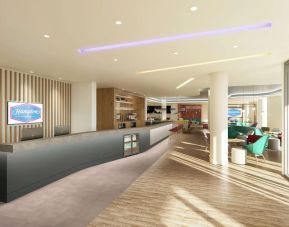 Bright lobby with lounge area at the Hampton by Hilton Manchester Northern Quarter.