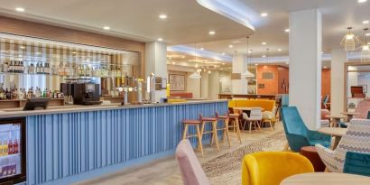 Hotel bar and lounge area at the Hampton by Hilton Manchester Northern Quarter.