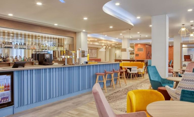 Hotel bar and lounge area at the Hampton by Hilton Manchester Northern Quarter.