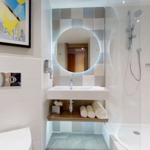 Guest bathroom with shower at the Hampton by Hilton Manchester Northern Quarter.