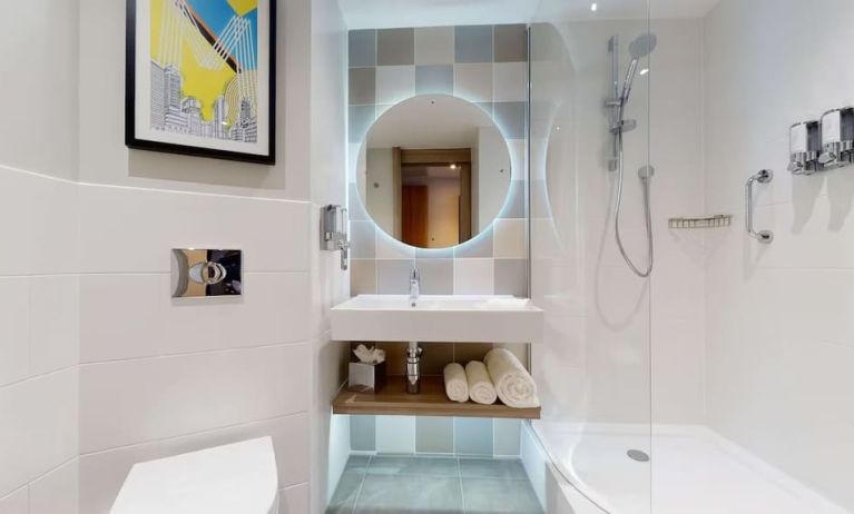 Guest bathroom with shower at the Hampton by Hilton Manchester Northern Quarter.