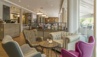 Lobby and coworking lounge at Hilton Garden Inn Bristol City Centre.