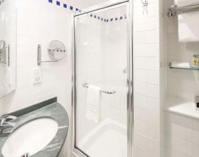 Guest bathroom with shower at Hilton Garden Inn Bristol City Centre.