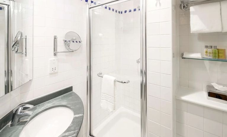 Guest bathroom with shower at Hilton Garden Inn Bristol City Centre.