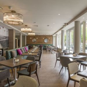 Dining area perfect for coworking at Hilton Garden Inn Bristol City Centre.