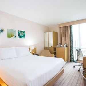 King bed with natural light at Hilton Garden Inn Glasgow City Centre.