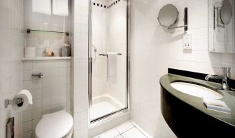 Guest bathroom with shower at Hilton Garden Inn Glasgow City Centre.