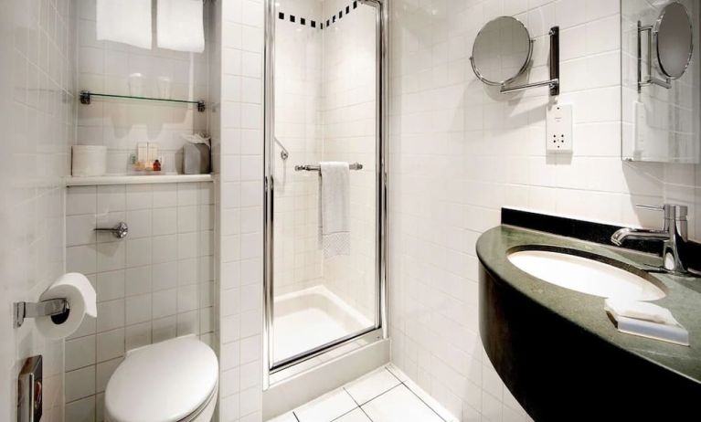 Guest bathroom with shower at Hilton Garden Inn Glasgow City Centre.