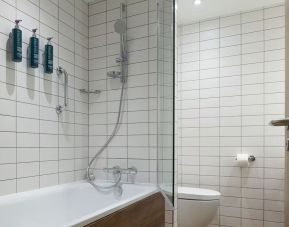 Guest bathroom with shower and tub at Hilton Garden Inn Stoke On Trent.