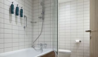 Guest bathroom with shower and tub at Hilton Garden Inn Stoke On Trent.