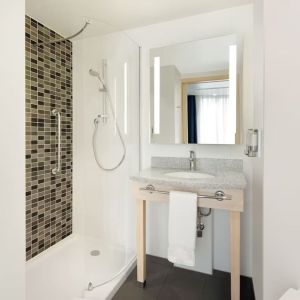 Guest bathroom at the Hampton by Hilton London Docklands.