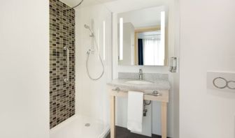 Guest bathroom at the Hampton by Hilton London Docklands.