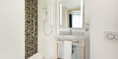 Guest bathroom at the Hampton by Hilton London Docklands.