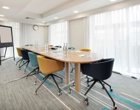 Bright meeting room with blackboard and comfortable mobiliary at the Hampton by Hilton London Docklands.