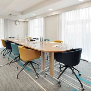 Bright meeting room with blackboard and comfortable mobiliary at the Hampton by Hilton London Docklands.