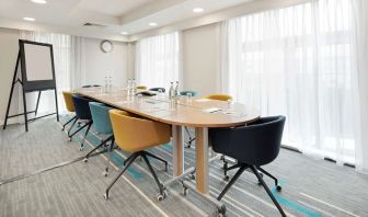 Bright meeting room with blackboard and comfortable mobiliary at the Hampton by Hilton London Docklands.