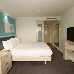 Day use room with TV and workdesk at the Hampton by Hilton London Docklands.