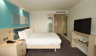 Day use room with TV and workdesk at the Hampton by Hilton London Docklands.