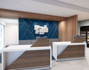 Hotel entrance and reception at Holiday Inn Express & Suites Bronx.