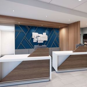 Hotel entrance and reception at Holiday Inn Express & Suites Bronx.