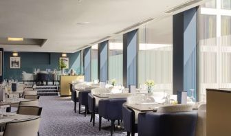 Spacious and elegant restaurant area perfect as workspace at the Hilton London Gatwick Airport.