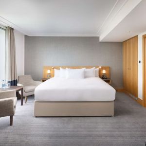 Day use guestroom with work desk and lounge area at the Hilton London Gatwick Airport.