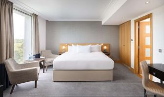 Day use guestroom with work desk and lounge area at the Hilton London Gatwick Airport.