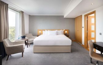 Day use guestroom with work desk and lounge area at the Hilton London Gatwick Airport.