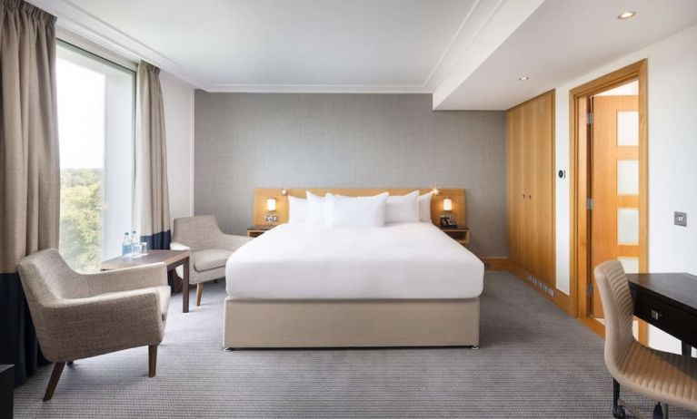 Day use guestroom with work desk and lounge area at the Hilton London Gatwick Airport.