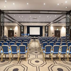 Spacious conference room for large crowds at the Hilton London Gatwick Airport.