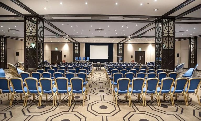 Spacious conference room for large crowds at the Hilton London Gatwick Airport.