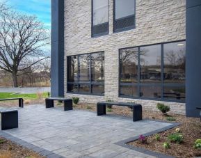 Outdoor seating and garden at Best Western Plus Secaucus Meadowlands.