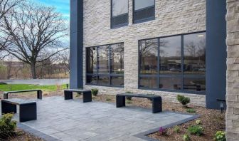 Outdoor seating and garden at Best Western Plus Secaucus Meadowlands.