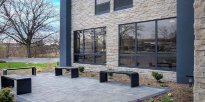 Outdoor seating and garden at Best Western Plus Secaucus Meadowlands.