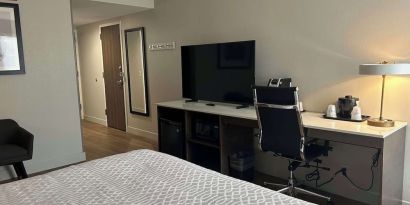 Romantic king room with TV at Best Western Plus Secaucus Meadowlands.