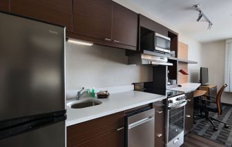 Kitchen area at TownePlace Suites Edgewood Aberdeen.