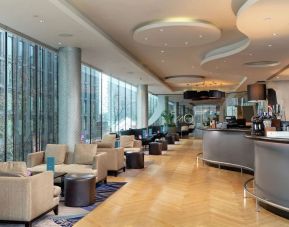 Dining area with natural light at Hilton London Wembley.