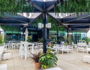 Dining area in rooftop perfect for coworking at Hilton London Wembley.