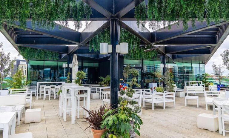 Dining area in rooftop perfect for coworking at Hilton London Wembley.