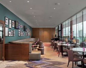 Dining area perfect for coworking at Hilton London Wembley.