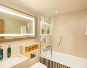 Guest bathroom with shower and tub at DoubleTree By Hilton London - Hyde Park.