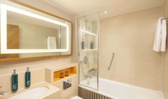 Guest bathroom with shower and tub at DoubleTree By Hilton London - Hyde Park.