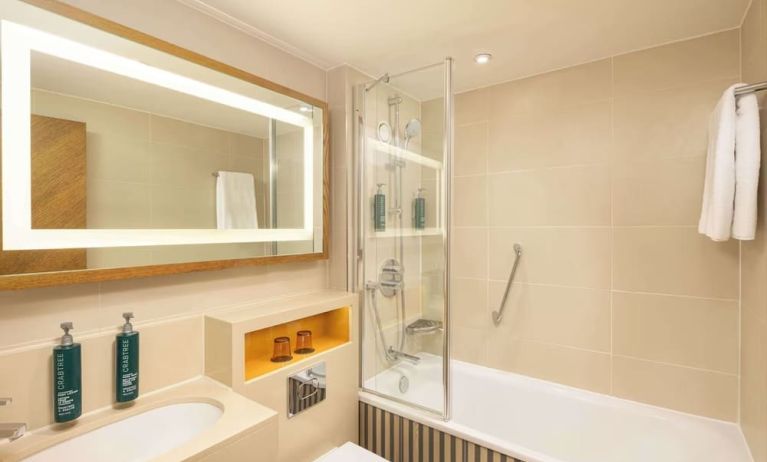 Guest bathroom with shower and tub at DoubleTree By Hilton London - Hyde Park.