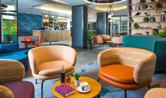 Lobby and coworking lounge at Hampton By Hilton London Park Royal.