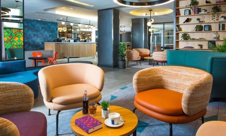 Lobby and coworking lounge at Hampton By Hilton London Park Royal.