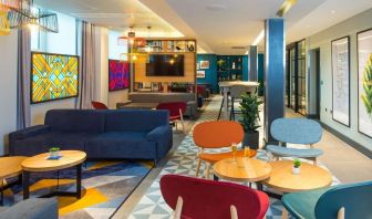 Lobby and coworking lounge at Hampton By Hilton London Park Royal.